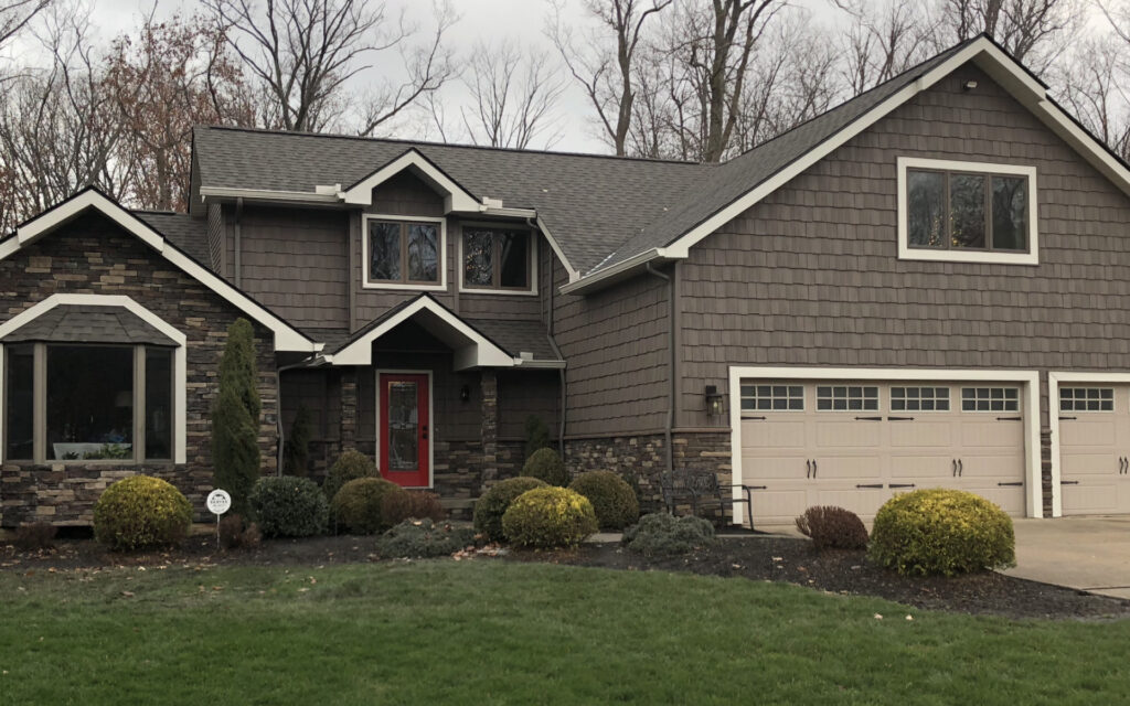 Dark Gray Siding and Stone Exterior